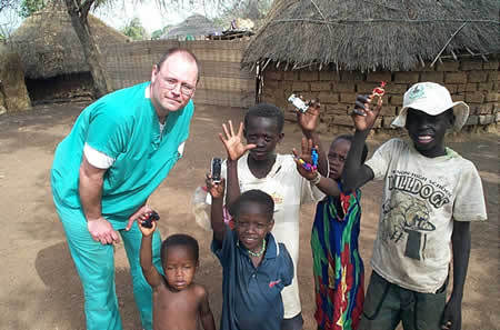Dr. Doshier on mission trip in Africa in 2003 with village children